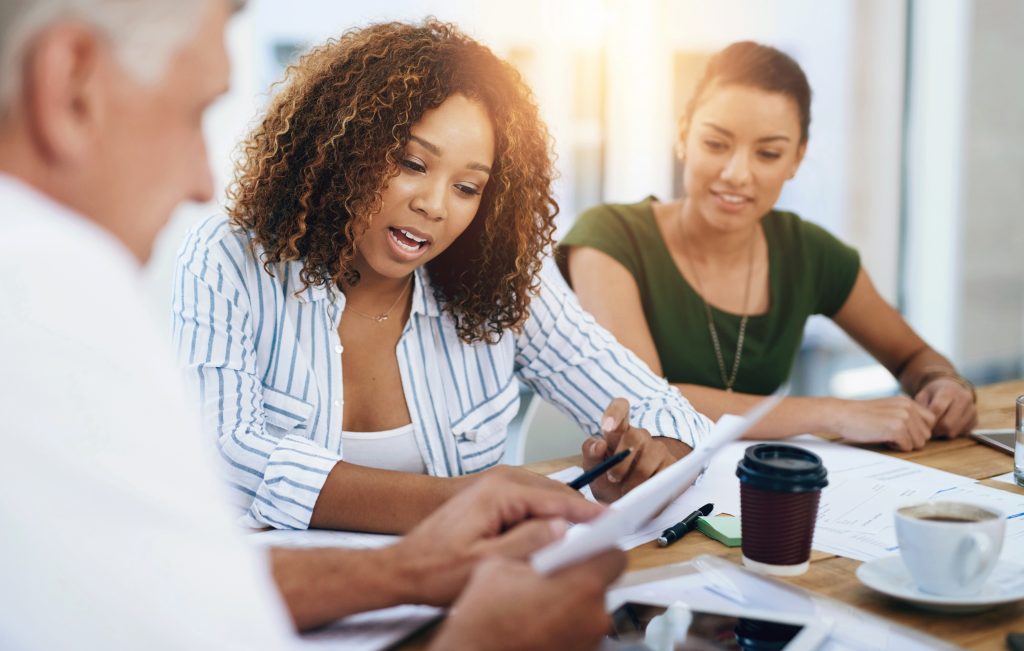 Group discussing paperwork