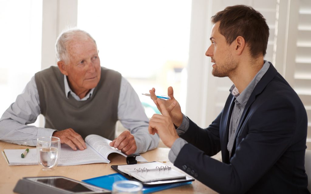 Older man getting advice from businessman