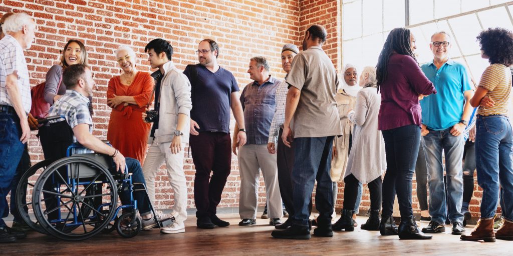 Diverse group of people socializing indoors